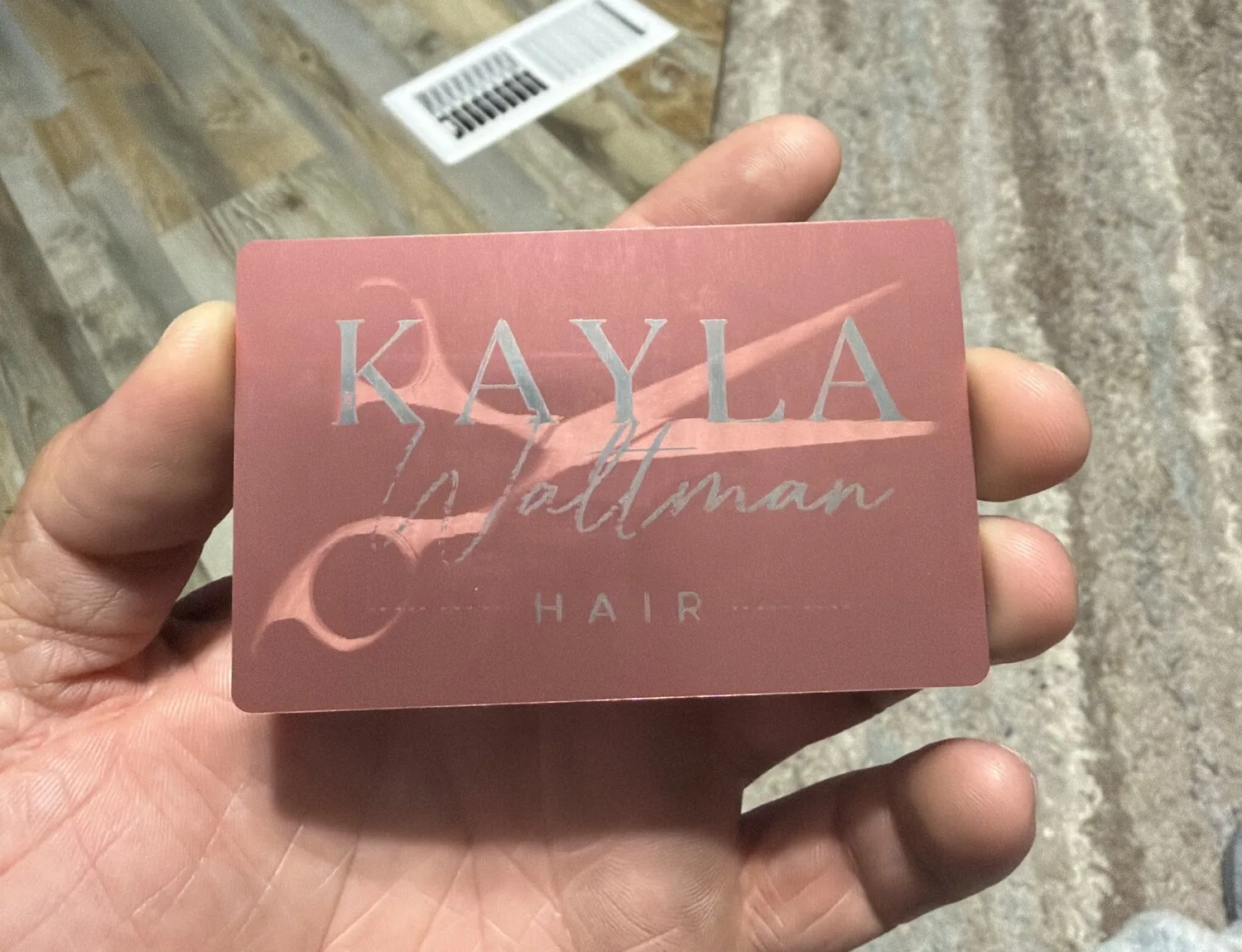 Rose gold engraved metal business card for Kayla Waltman Hair at Dazzles Hair Studio with scissors artwork